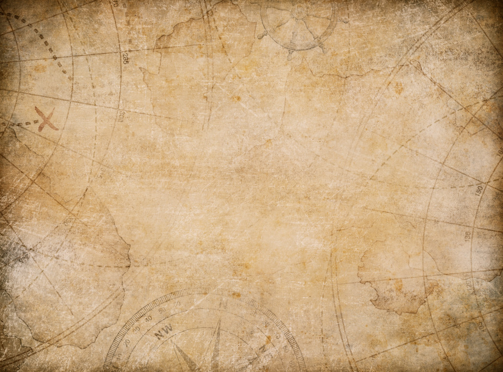 aged treasure map background with compass - Aurora Publicity